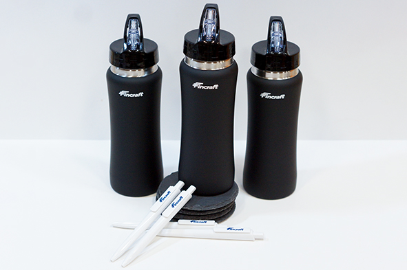 branded water bottle and pens